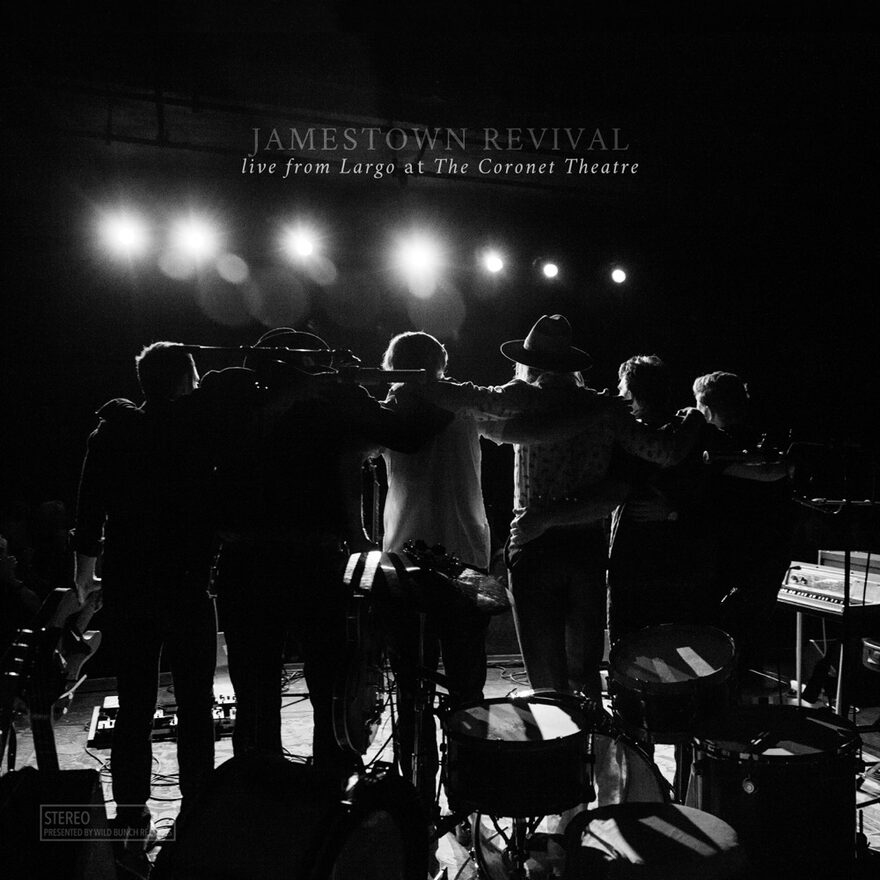 Album cover: Live from Largo at the Coronet Theatre, the band standing arm in arm facing stage lights